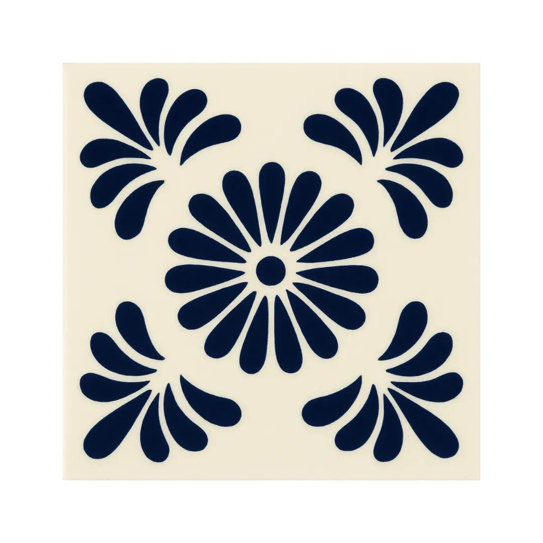 A hand painted Talavera tile from Puebla, Mexico with deep midnight blue and marigold tones. 